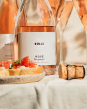 BOLLE Rosé twice-fermented non-alcoholic wine label close-up with appetizers, premium alcohol-free sparkling wine